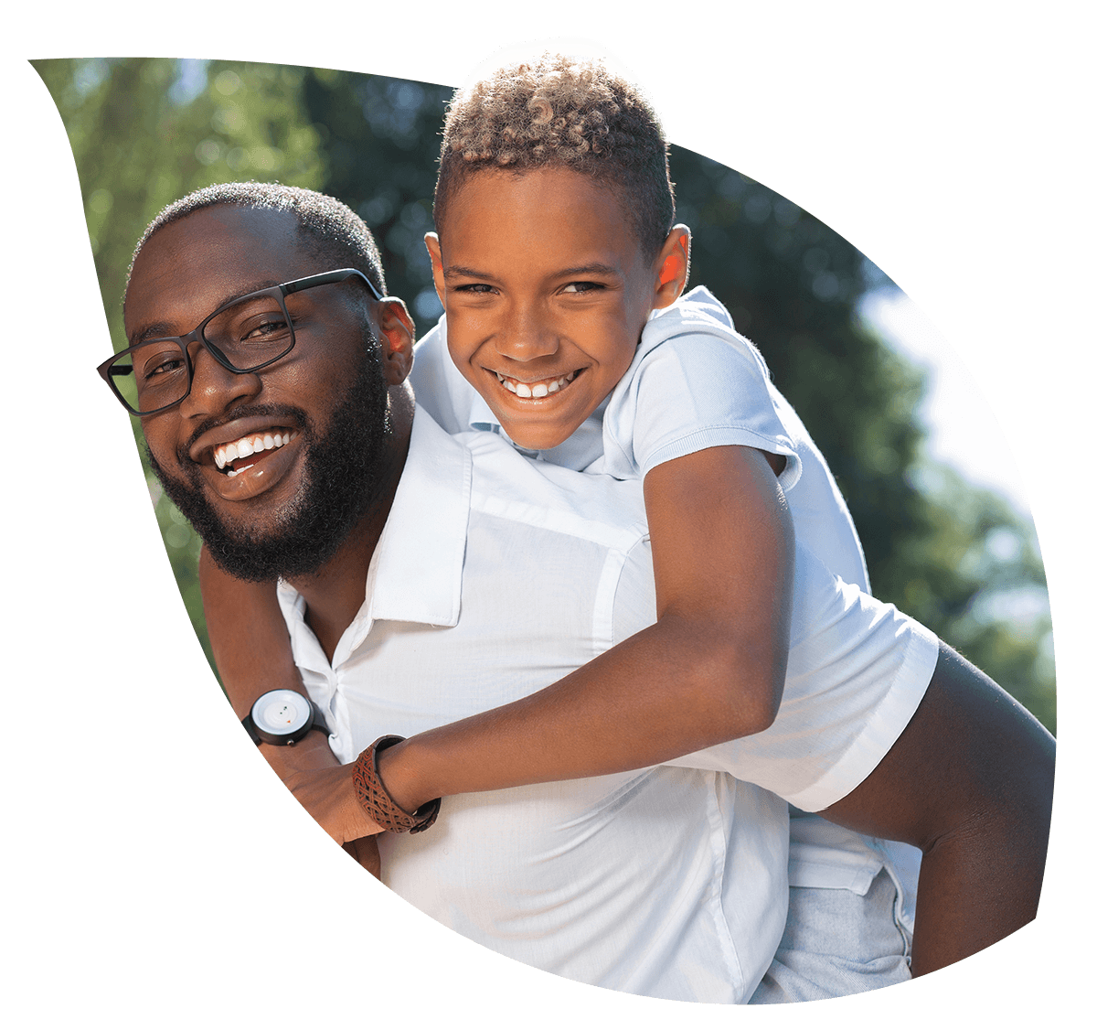 Father with his son on his back, both are smiling